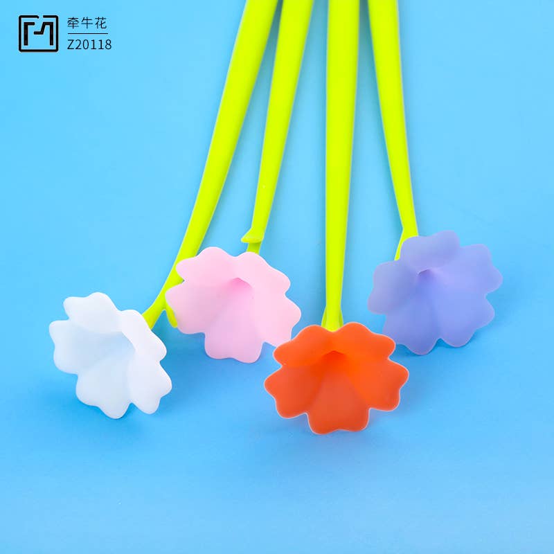 Colorful flower-shaped bottle stoppers on a blue background