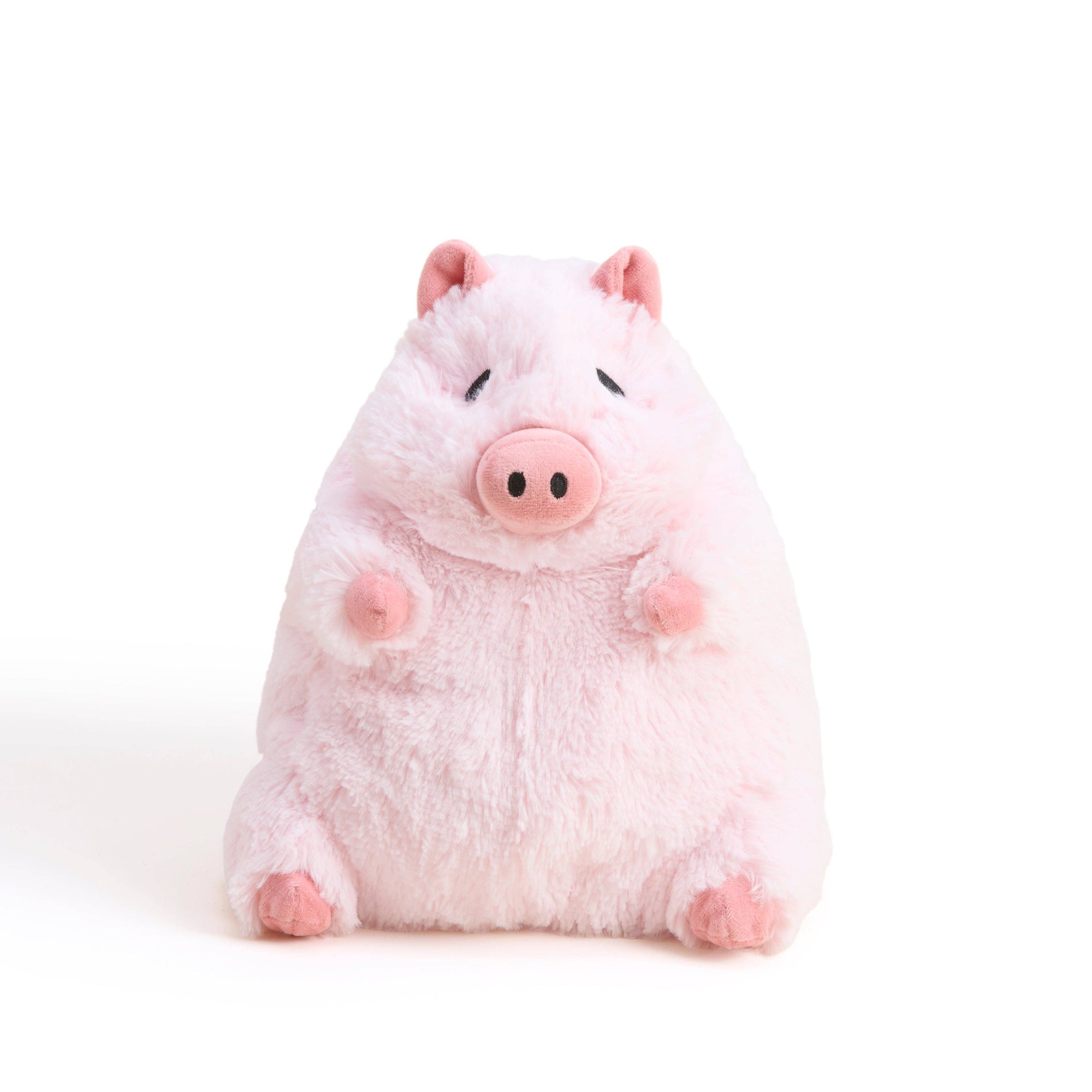 Plush toy pig on a white background