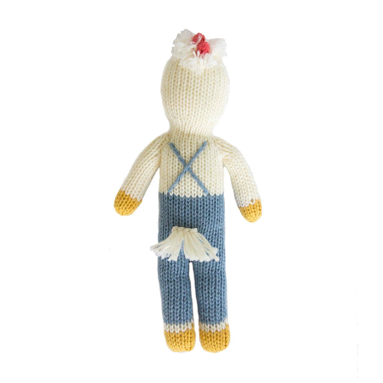 Knitted toy chicken wearing blue overalls on a white background