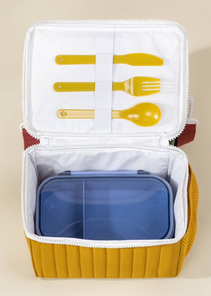 Yellow lunch box with compartments and cutlery illustration on a beige background