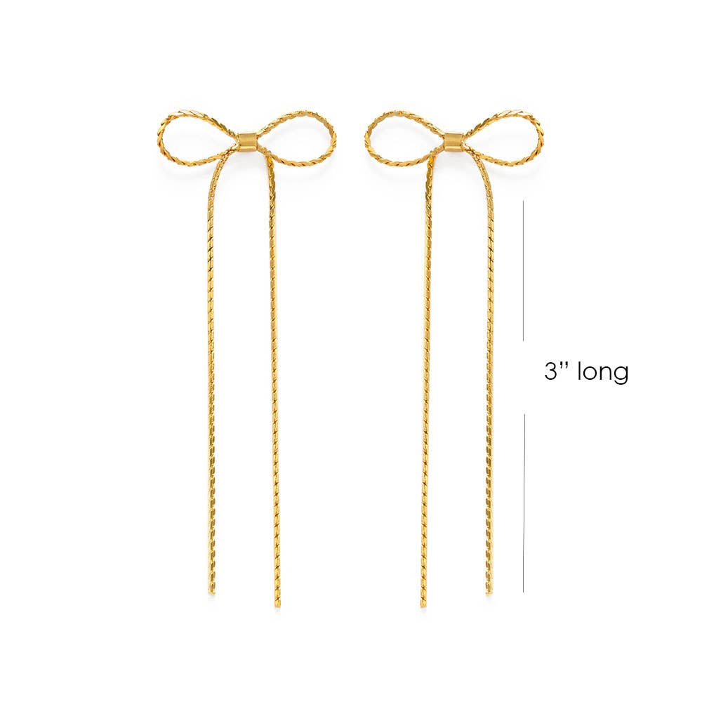 Gold bow-shaped earrings on a white background with a measurement label.