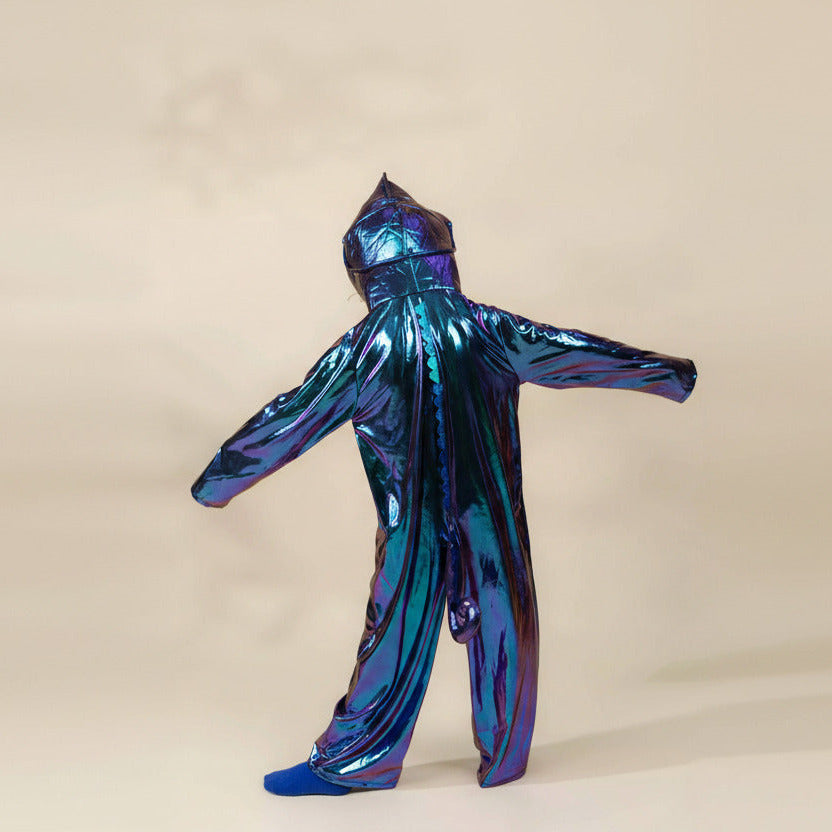 Holographic blue and purple jumpsuit on a beige background