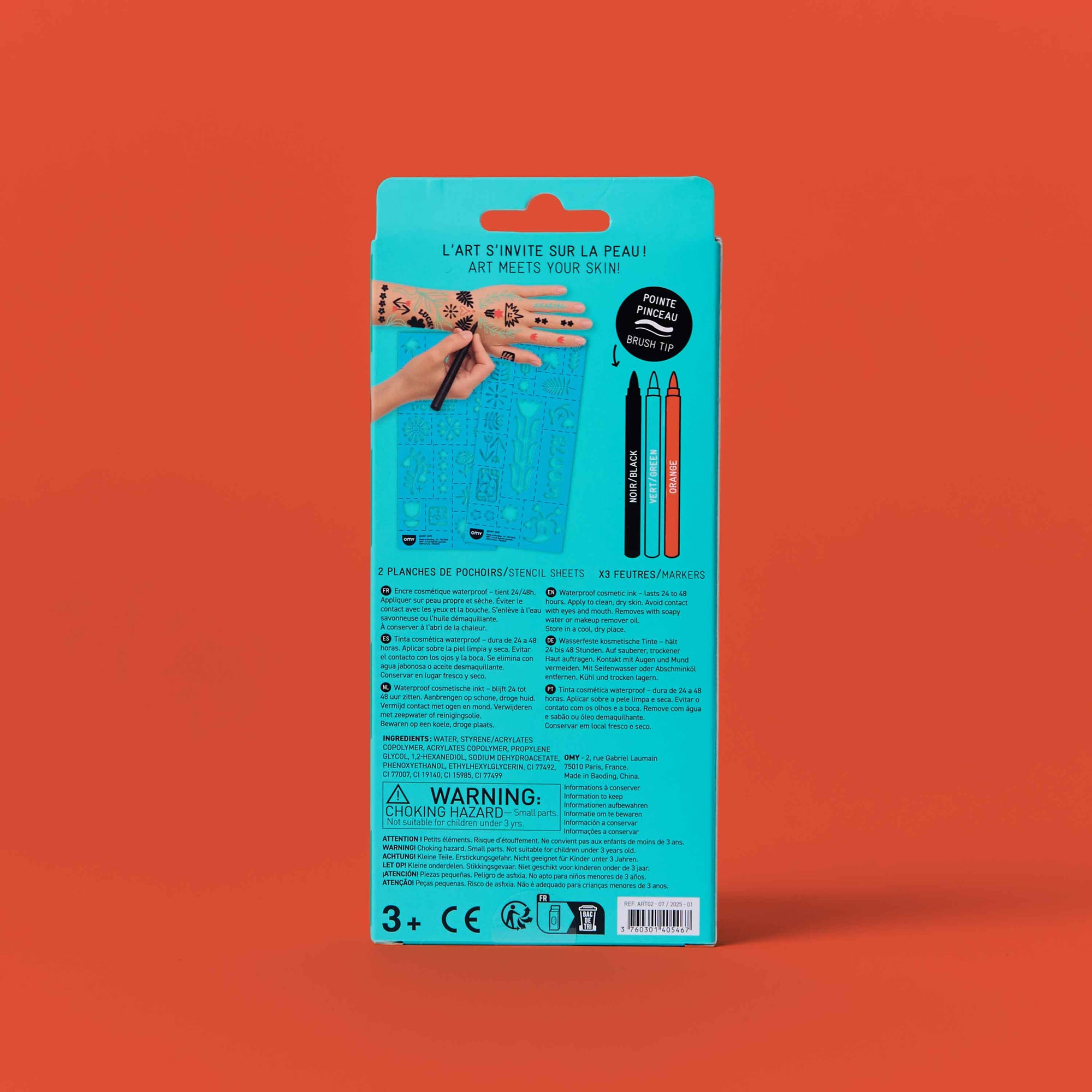 Product packaging with a hand holding a pen on a red background