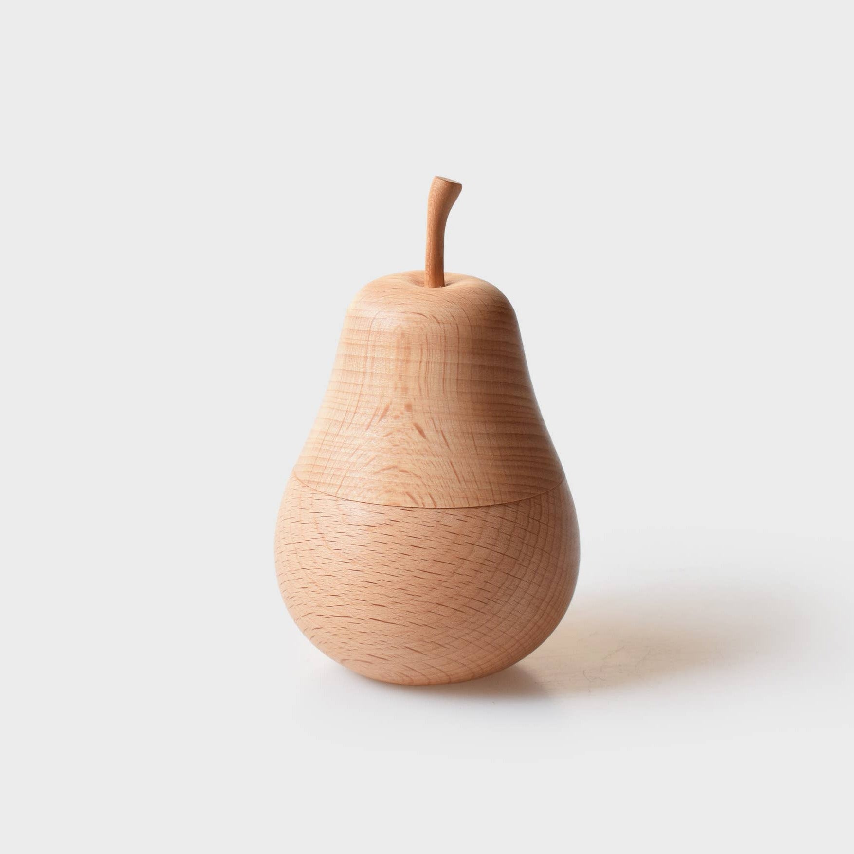 Wooden pear-shaped object on a white background