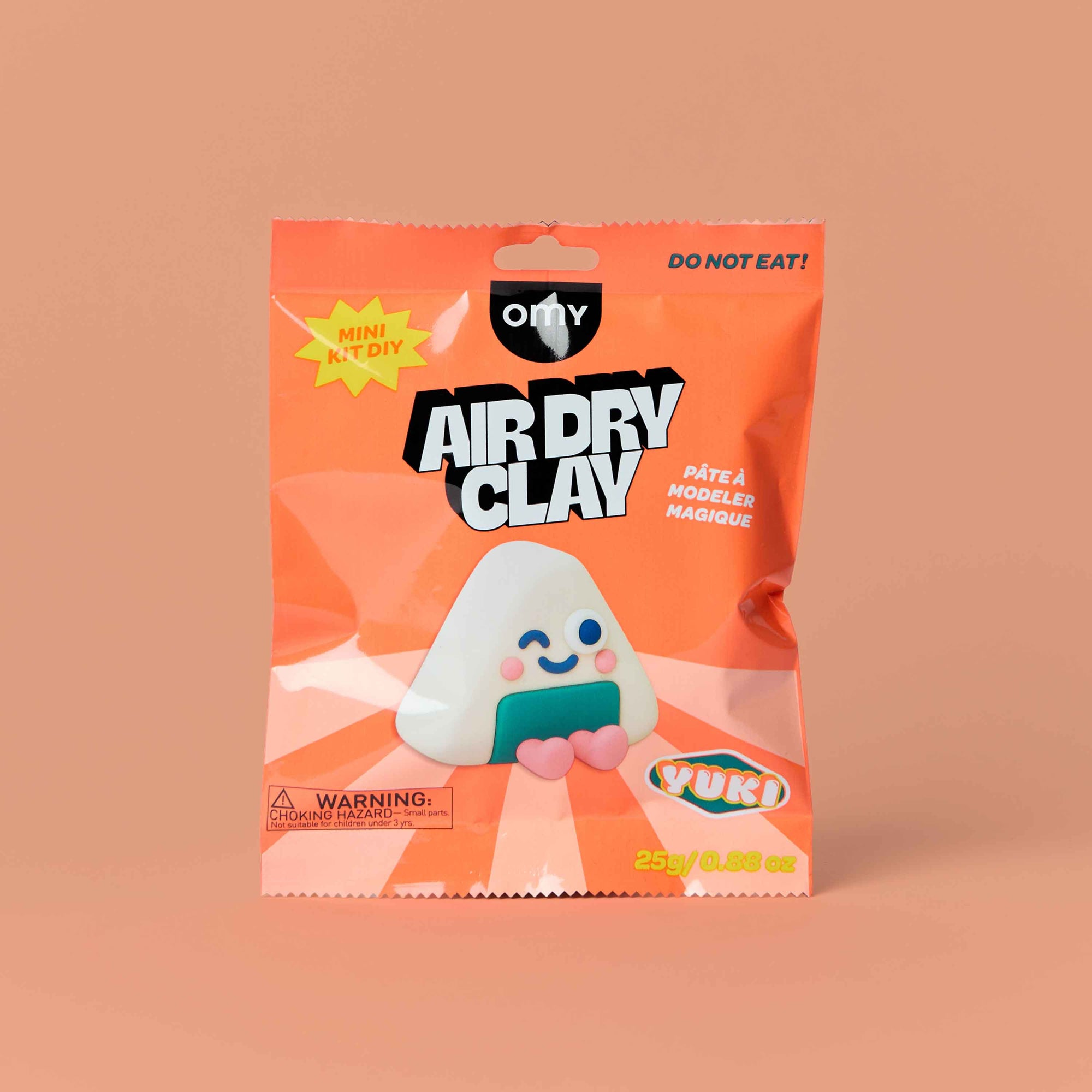 Package of OMY Air Dry Clay with a cartoon character on an orange background