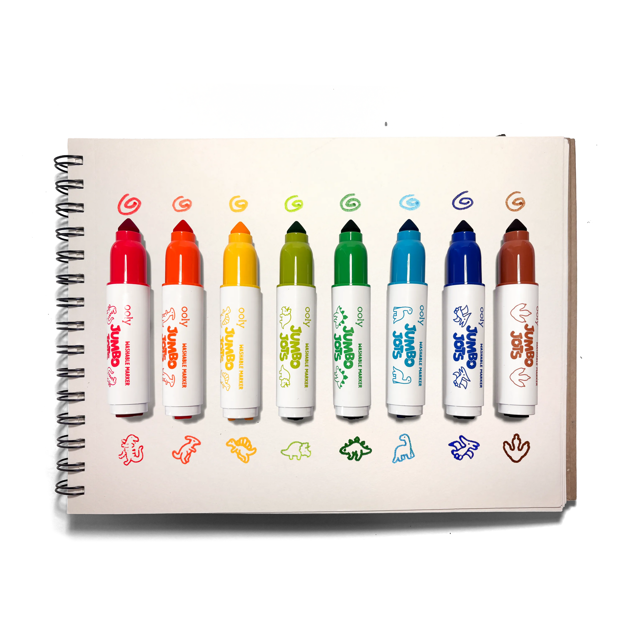 Set of colorful markers on a notebook with cartoon character designs.