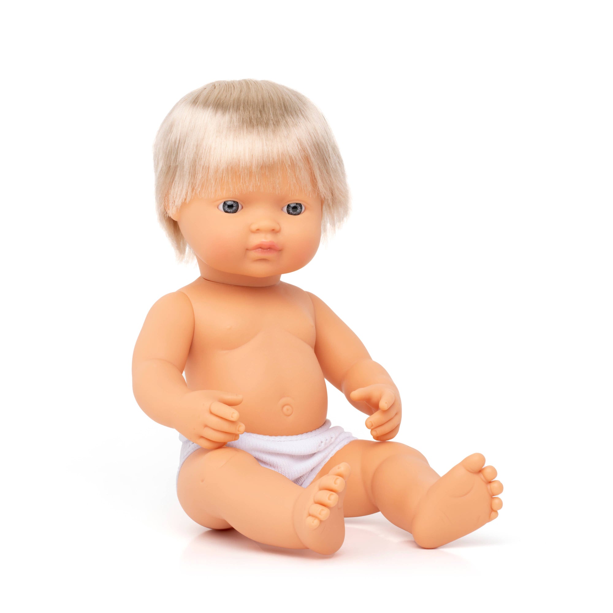 Baby doll with blonde hair and a diaper on a white background
