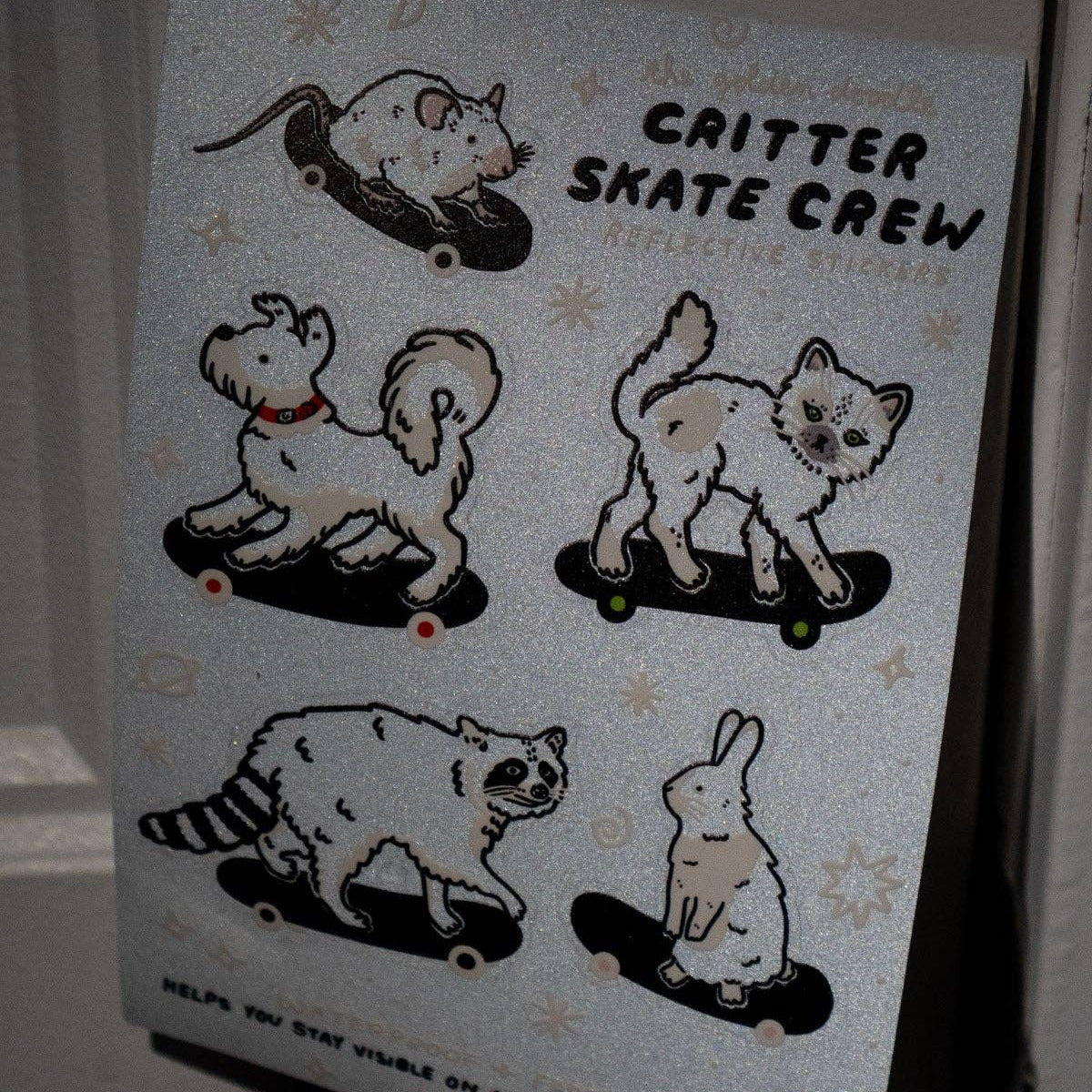 Sheet of stickers with cat illustrations and text on a white background
