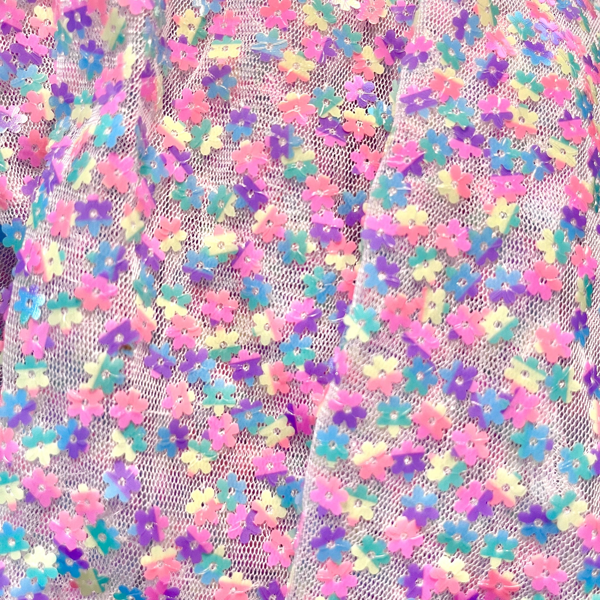 Close-up of colorful floral fabric with a white background