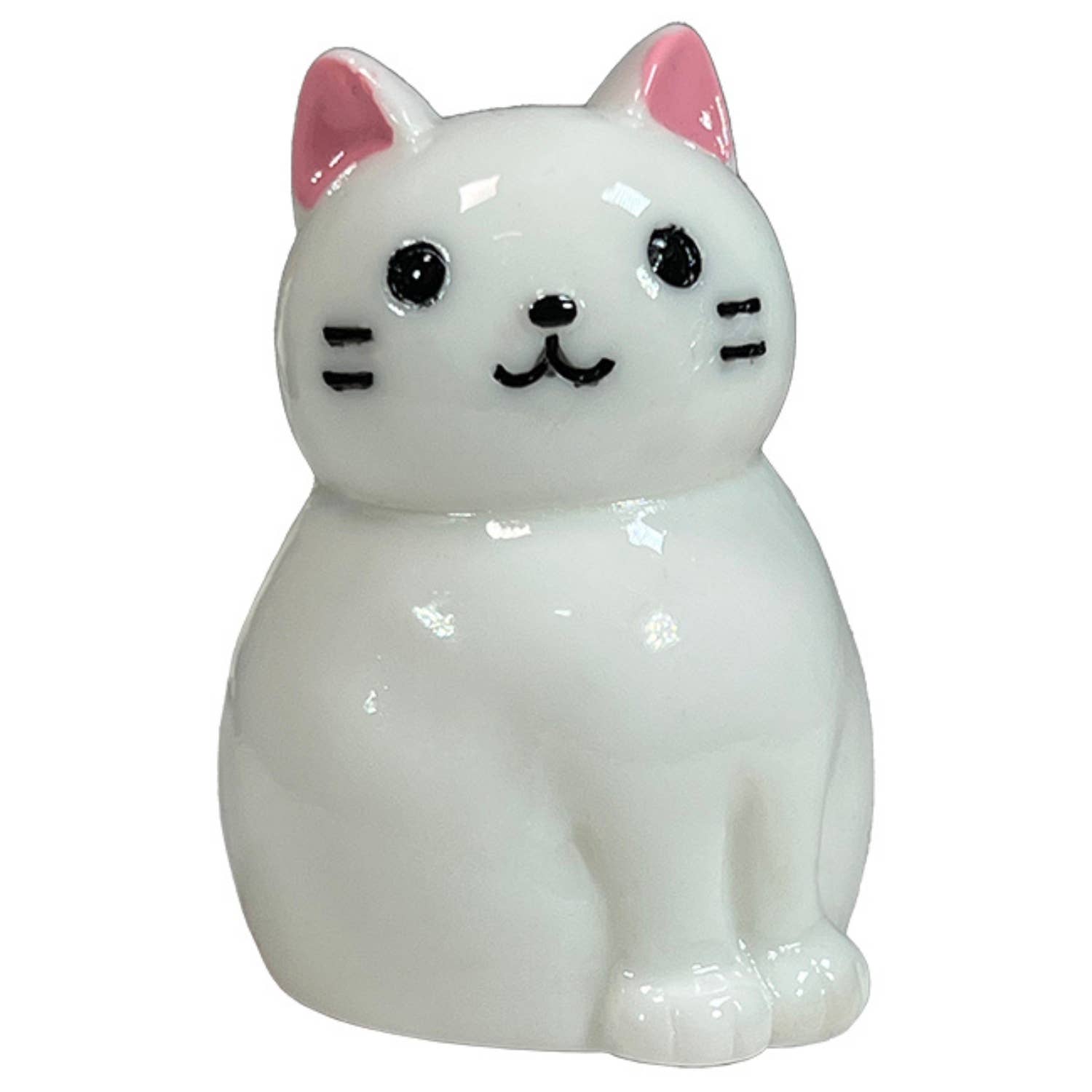 White cat-shaped figurine with pink ears on a white background