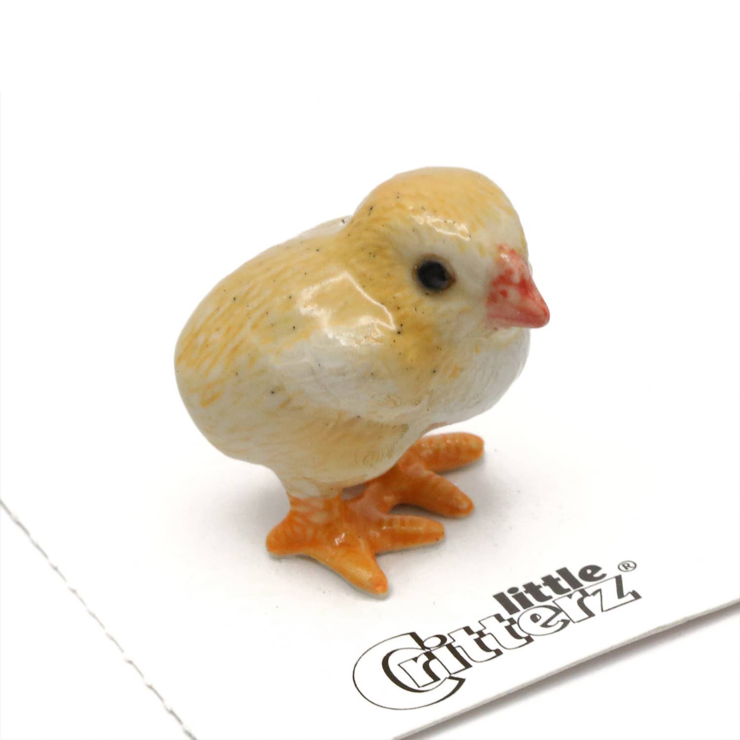 Small ceramic chick figurine on a white background with 'Little Critterz' branding.