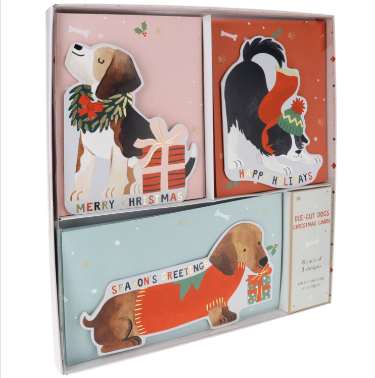 Set of Christmas-themed greeting cards with dog illustrations in a box.