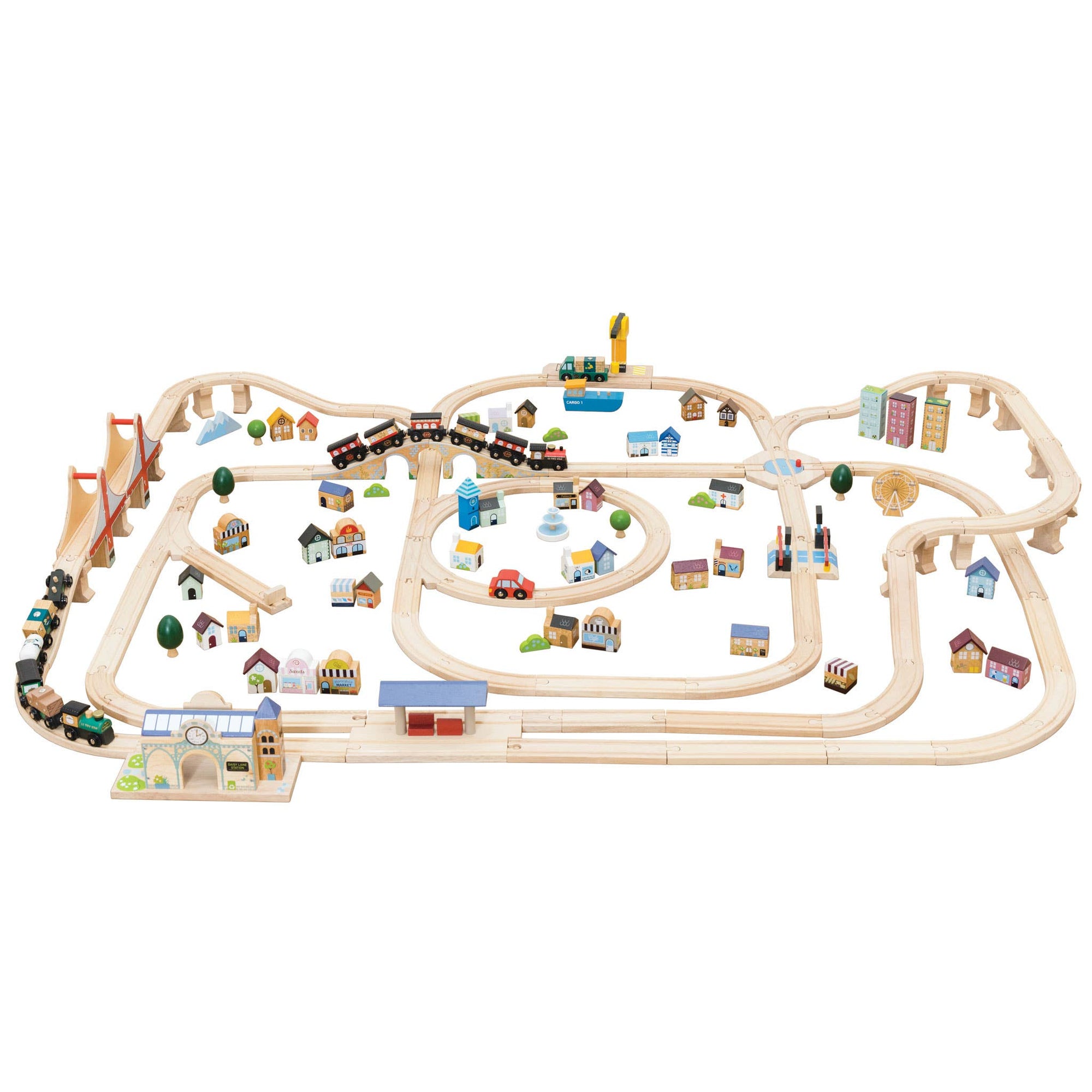 Wooden train track set with small buildings and trees on a white background