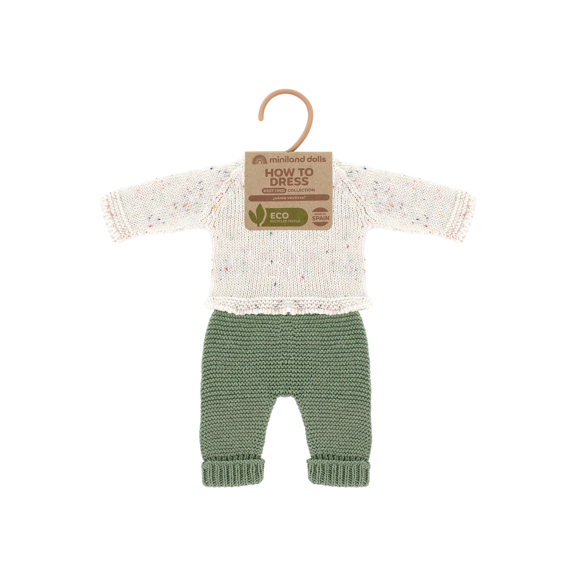 Knitted doll's sweater and pants set on a hanger with 'How to Dress' label on a white background