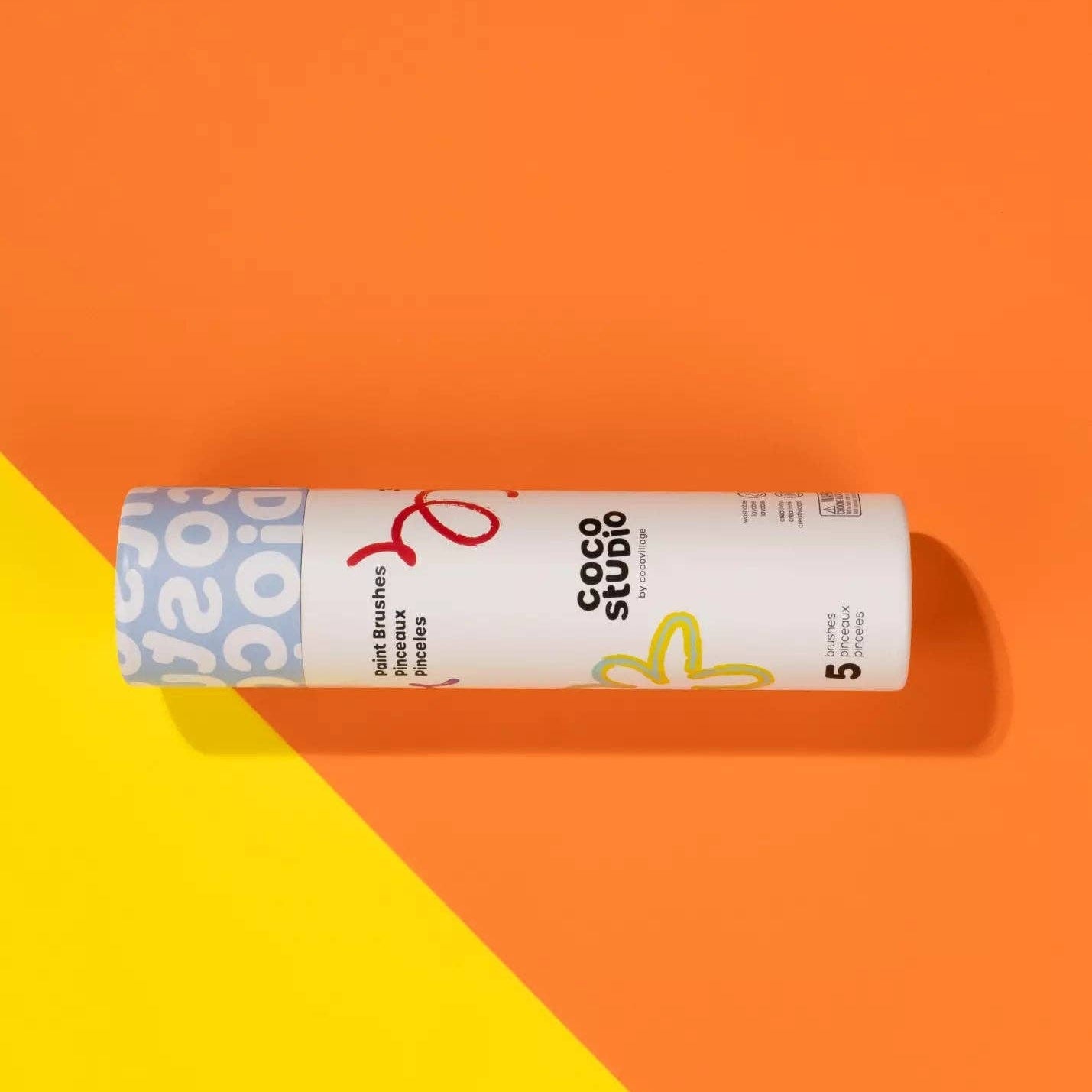 Coca-Cola Zero Sugar can on a two-tone orange and yellow background