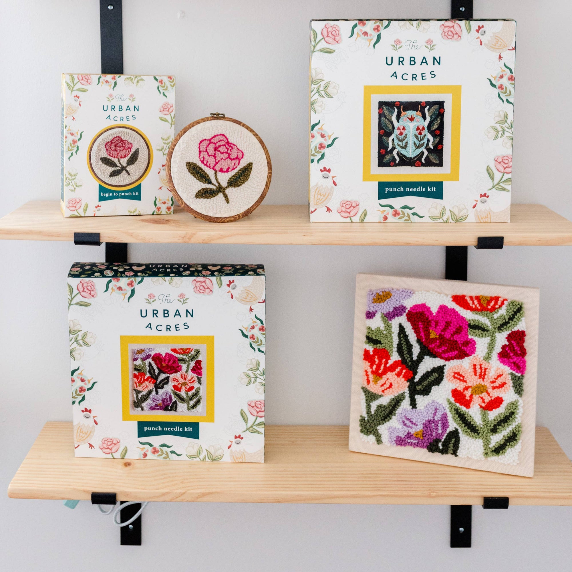 Shelves with decorative boxes and framed artwork labeled 'Urban Acres'.