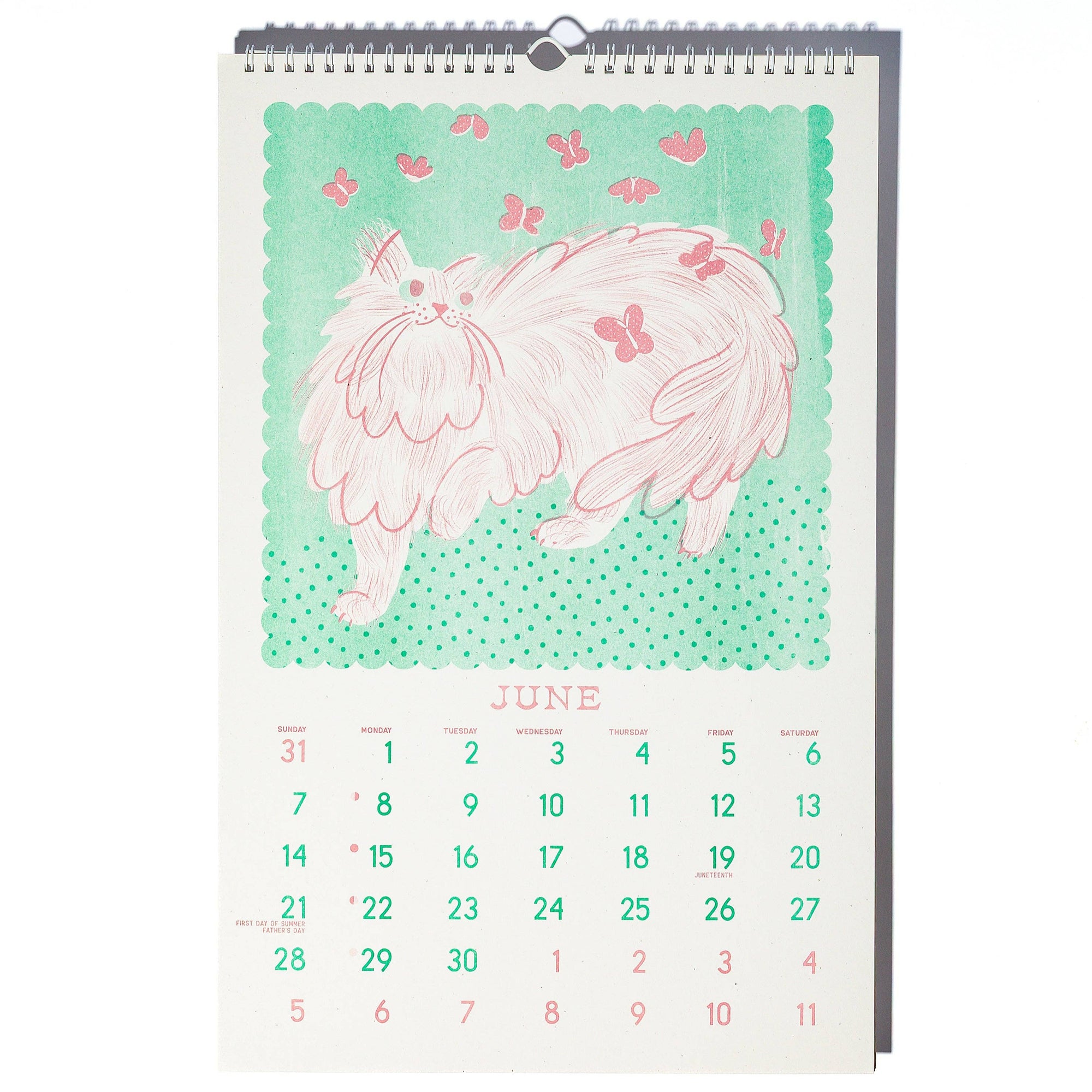 Calendar with a pink cat illustration on a light green background