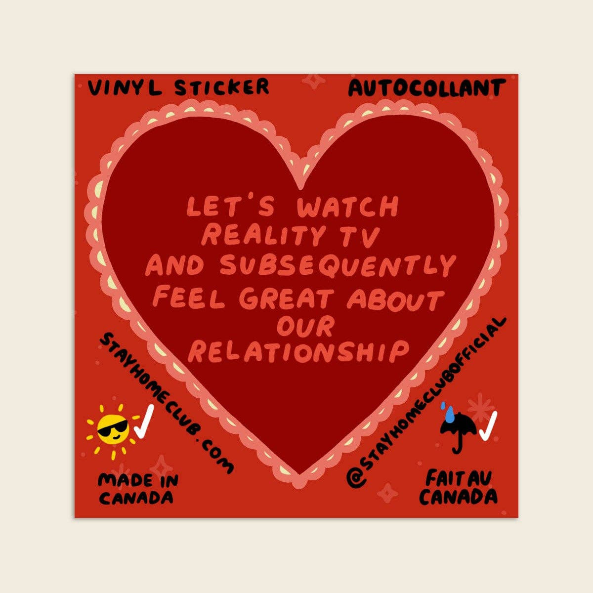 Red heart-shaped sticker with text on a beige background