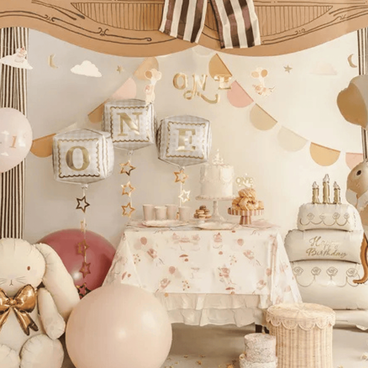 Decorated room for a child's first birthday with balloons, cake, and decorations.