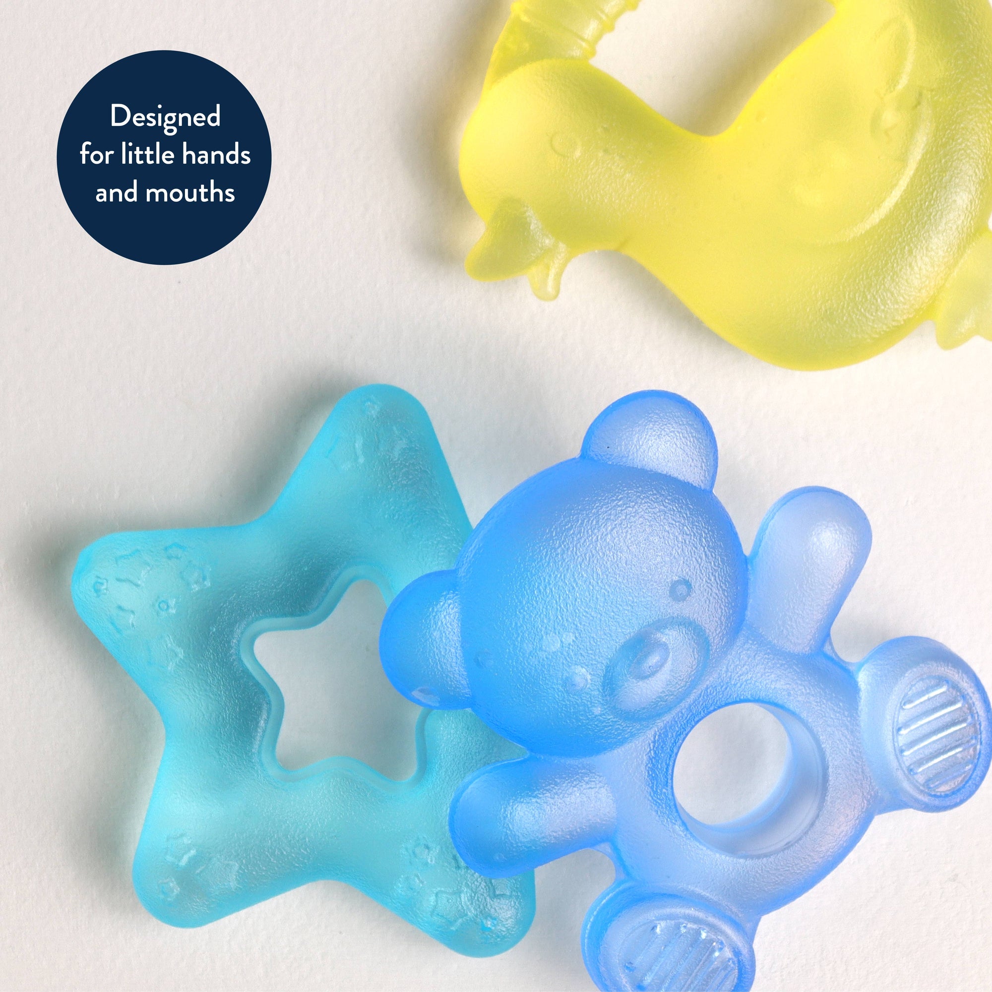 Two baby teething toys, one blue star-shaped and one blue bear-shaped, on a light gray background.