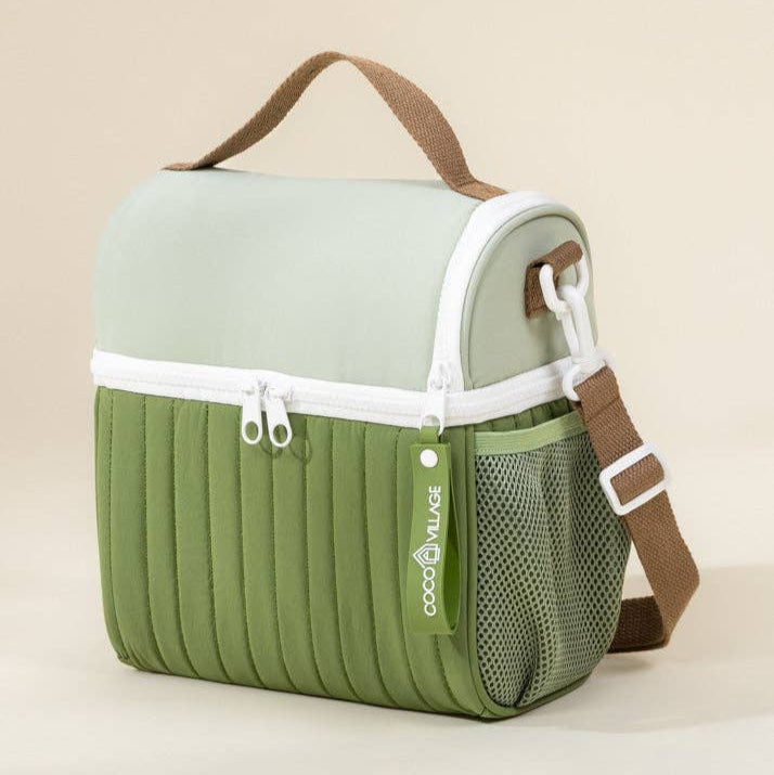 Green and beige lunchbox bag with a strap on a beige background