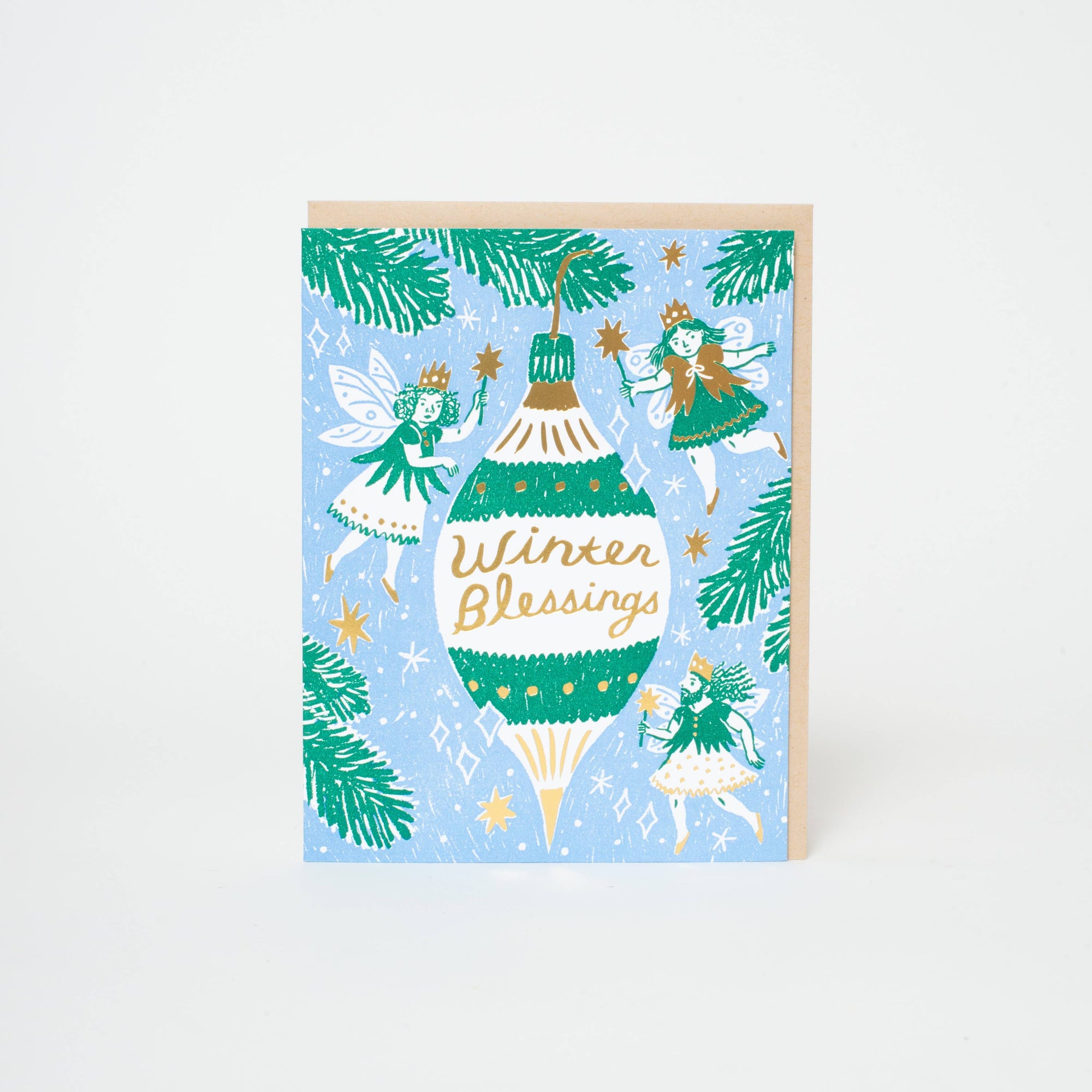 Greeting card with fairies and a Christmas ornament on a light blue background