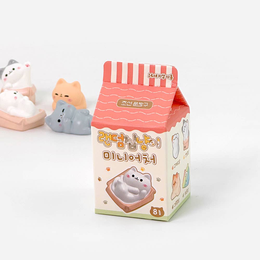 Cartoon cat-shaped product packaging with a pink and white striped design on a white background.