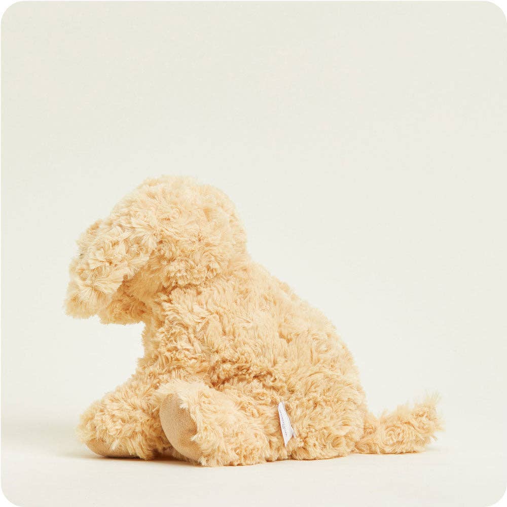 Beige plush dog toy on a light beige background