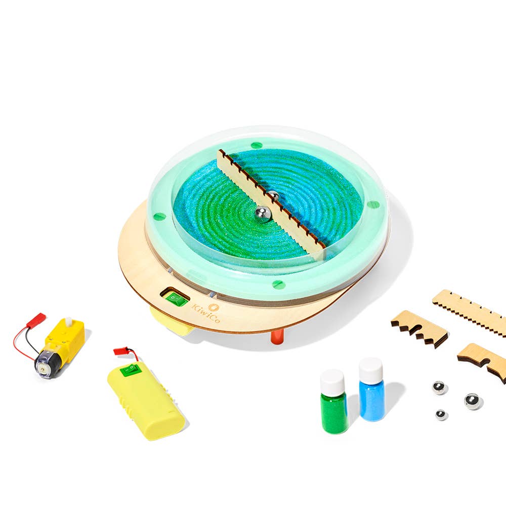 Children's science experiment kit with a circular device, batteries, and small bottles on a white background