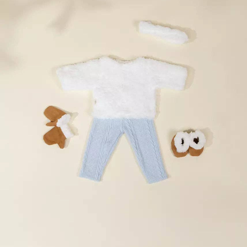 doll outfit with white shirt, blue pants, and brown shoes on a beige background