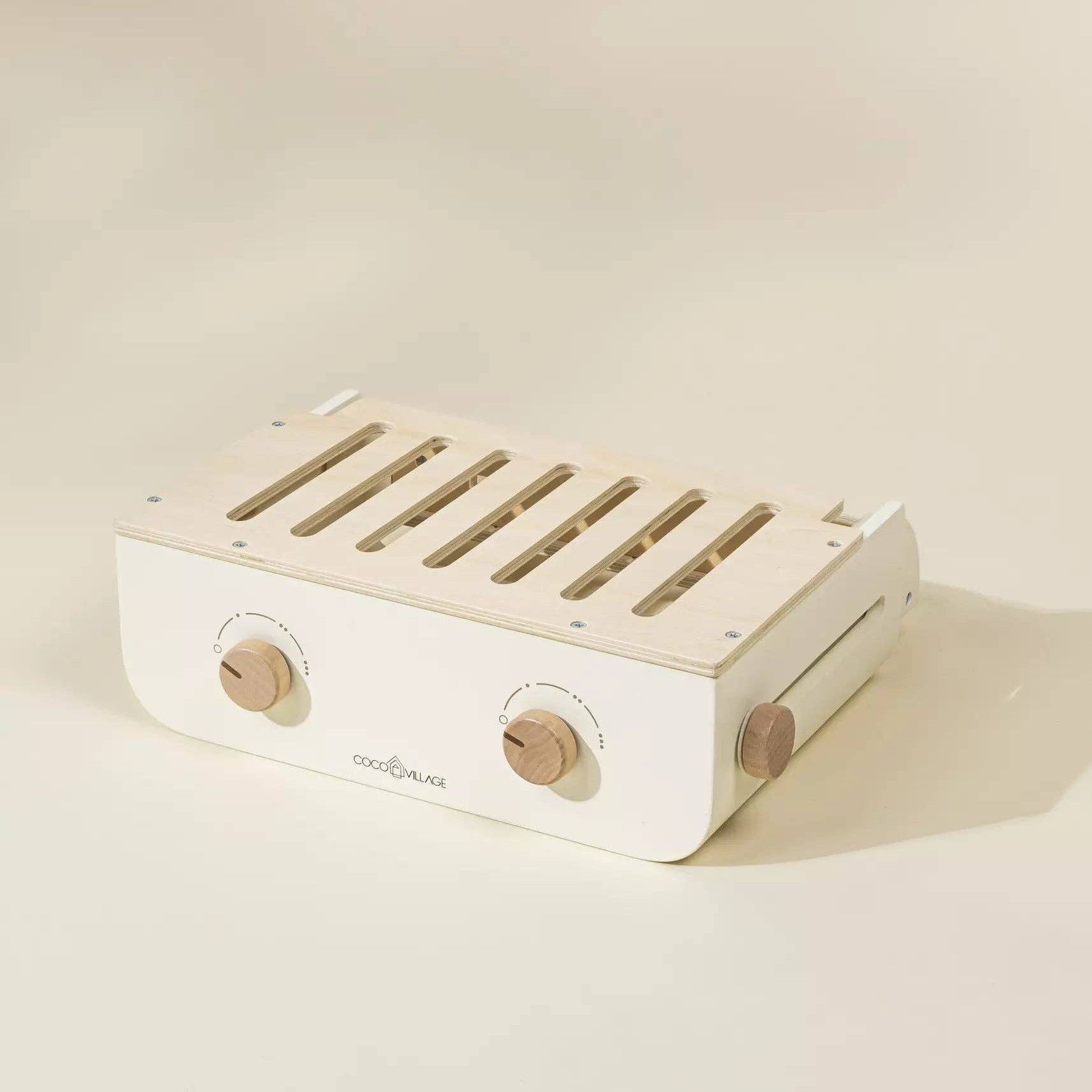 White audio amplifier with wooden accents on a beige background