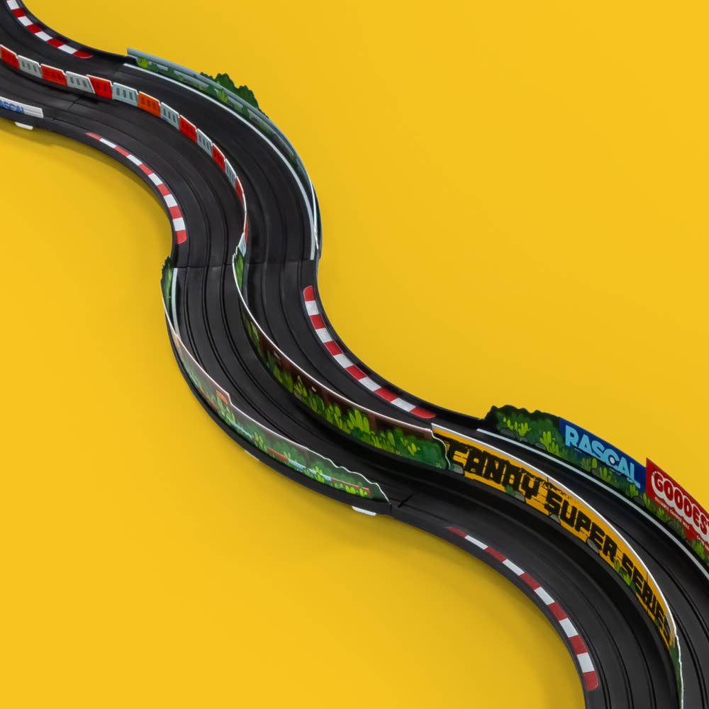 Model race track with colorful details on a yellow background