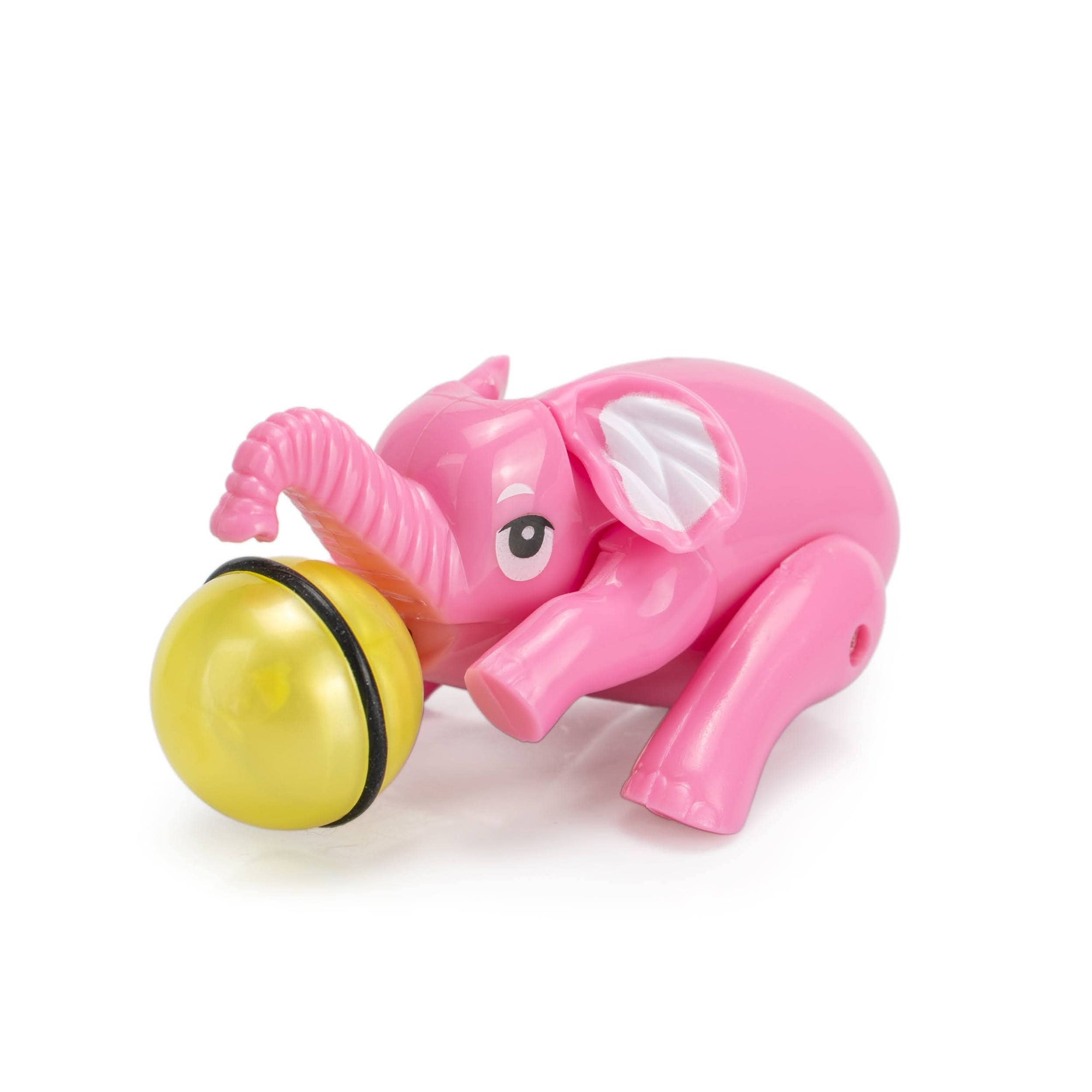 Pink elephant toy with a yellow ball on a white background