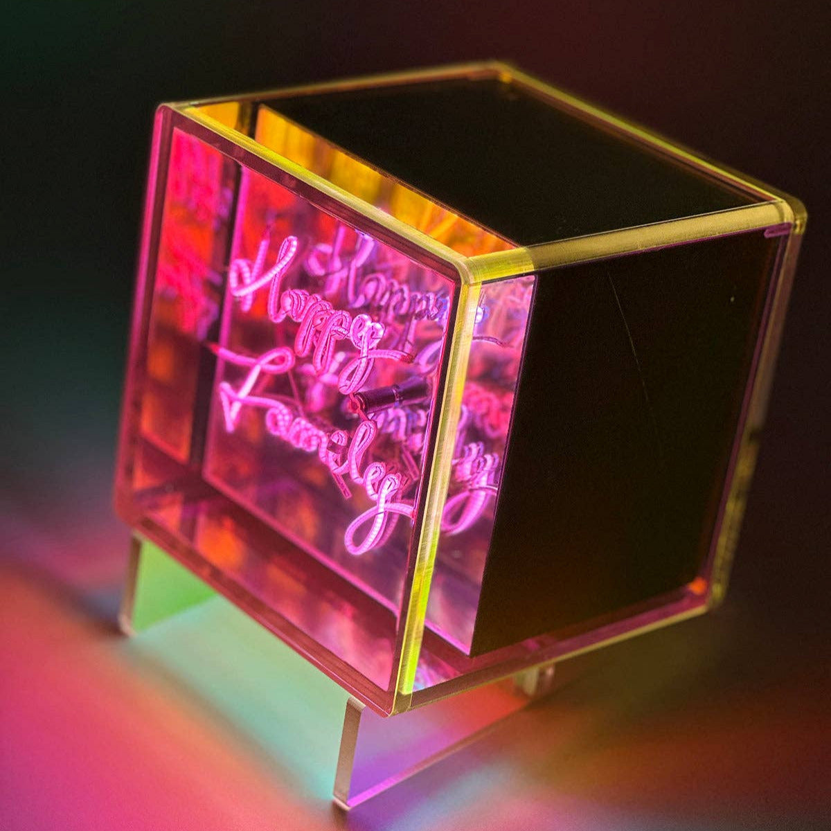 Neon sign with 'Happy Family' text on a dark background