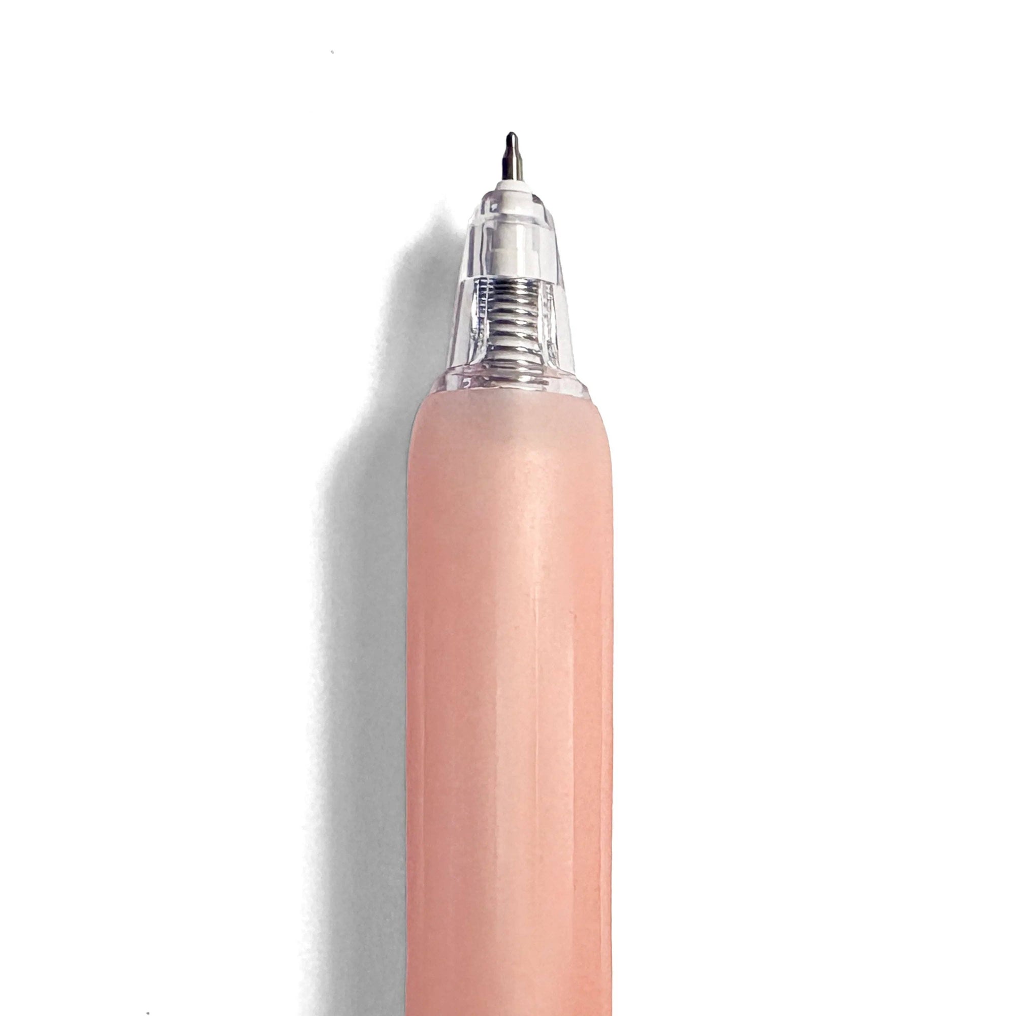 Pink pen with a clear cap on a white background