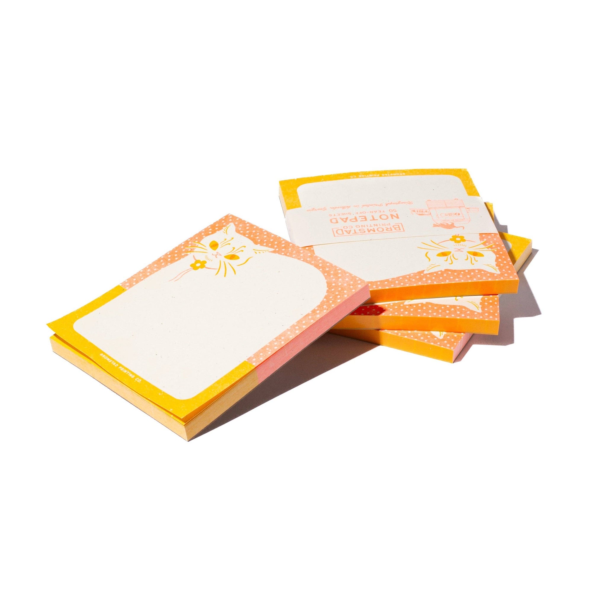 Stack of colorful sticky notes with a sun design on a white background