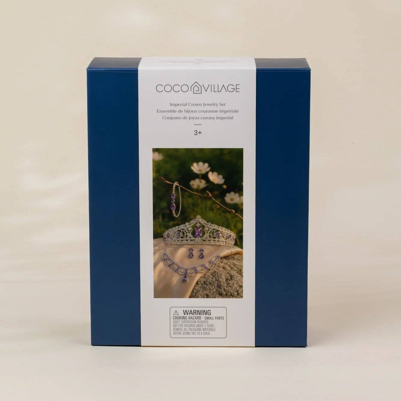 Coco Village jewelry set in its original blue and white packaging box, featuring a photo of a crown and necklace on the front.