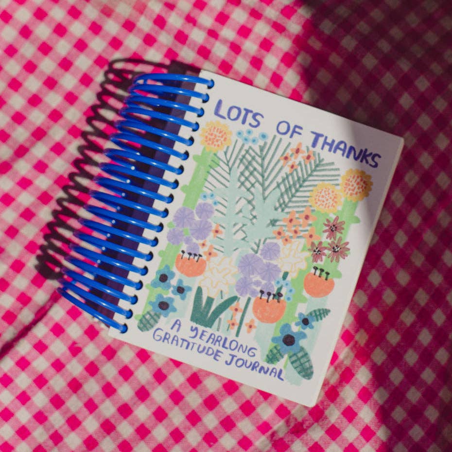 Journal titled 'Lots of Thanks' on a pink checkered background