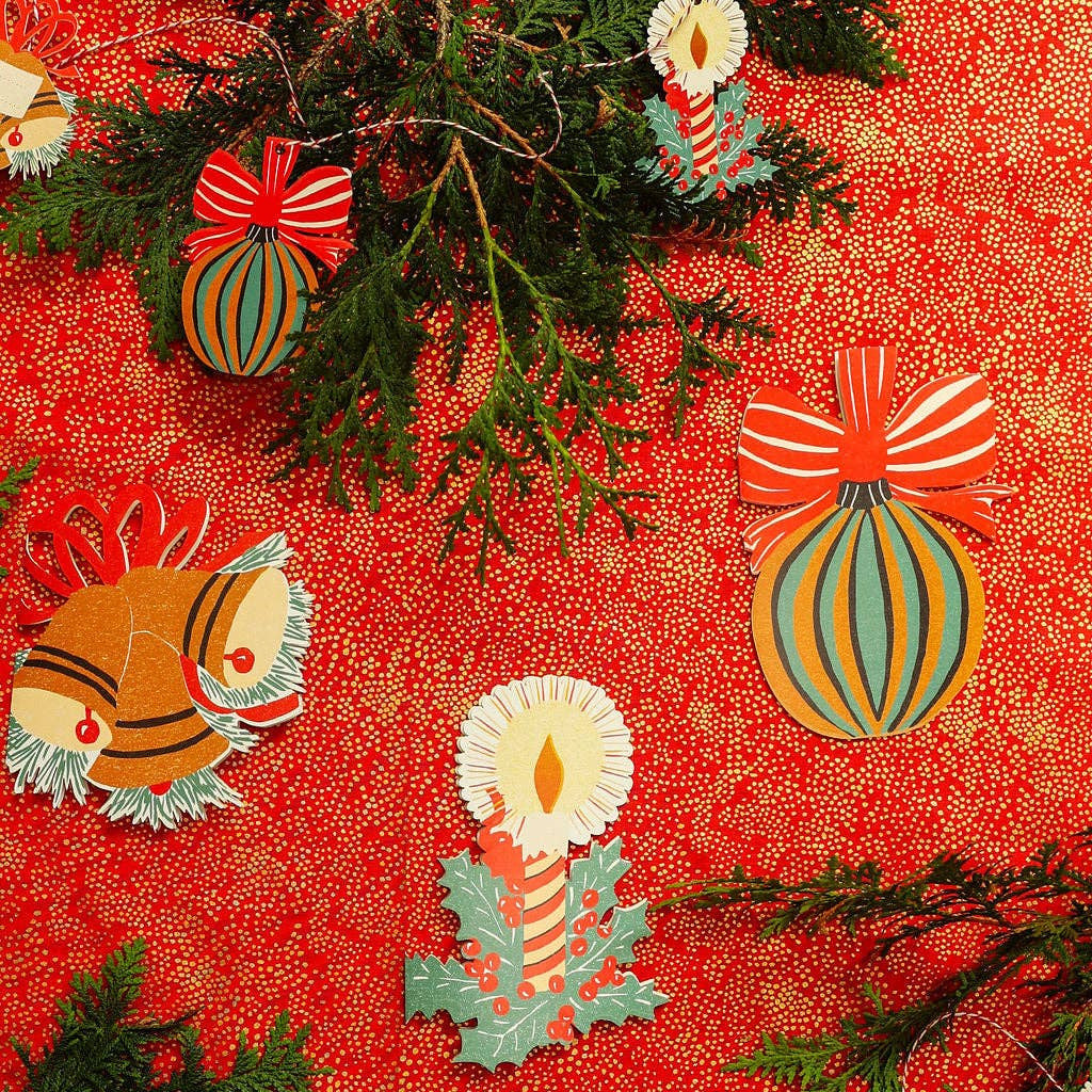 Decorative paper with Christmas-themed designs on a red background