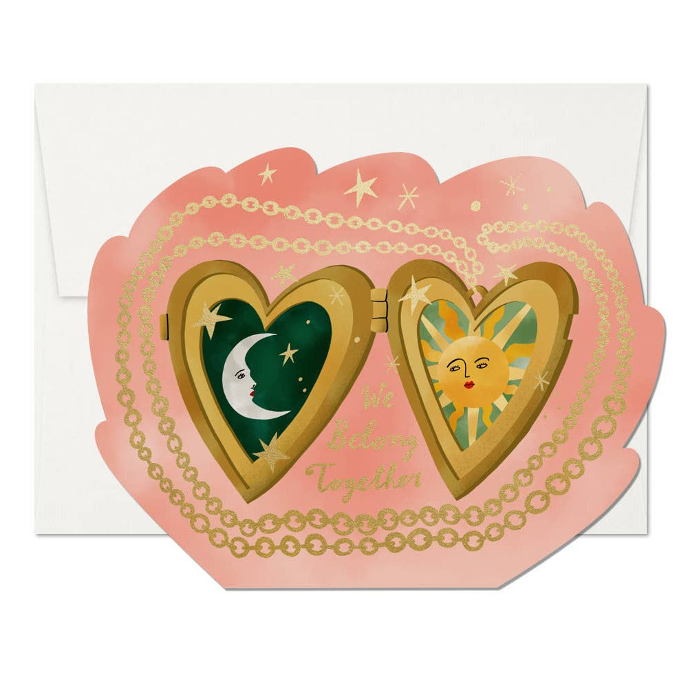Heart-shaped card with sun and moon design on a white background