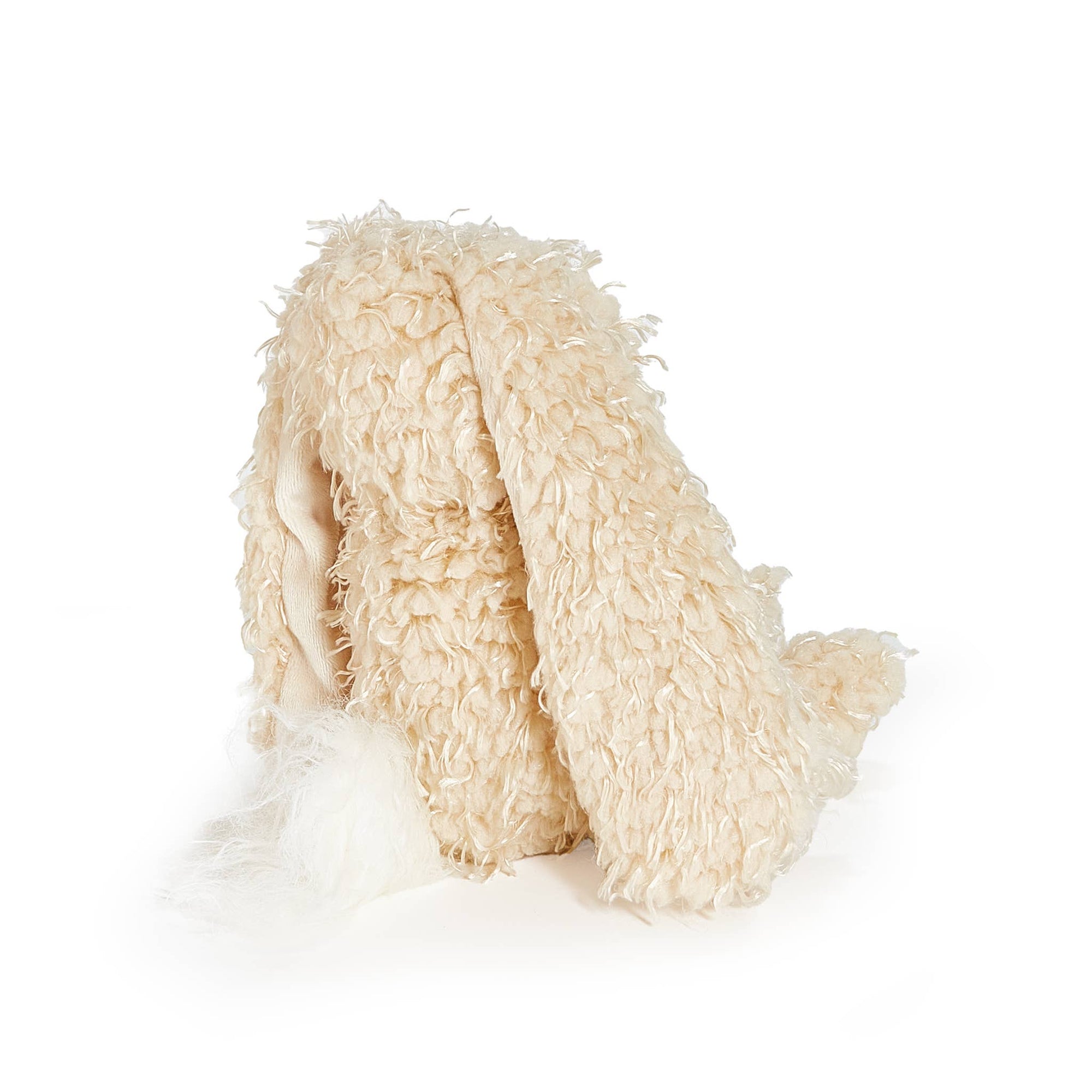 Beige fluffy bunny on a white background