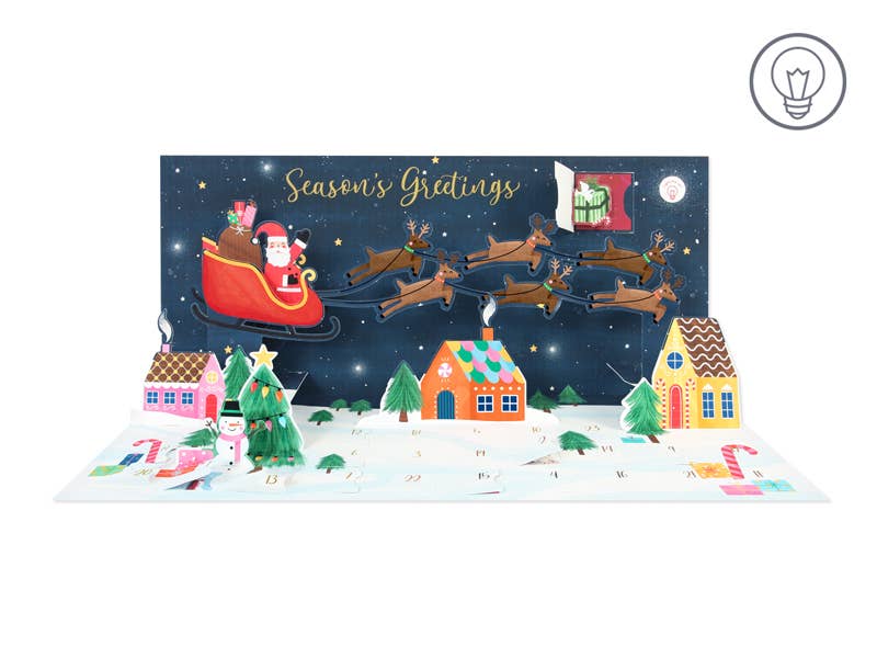 Christmas-themed pop-up card with Santa Claus and reindeer, featuring 'Season's Greetings' text.