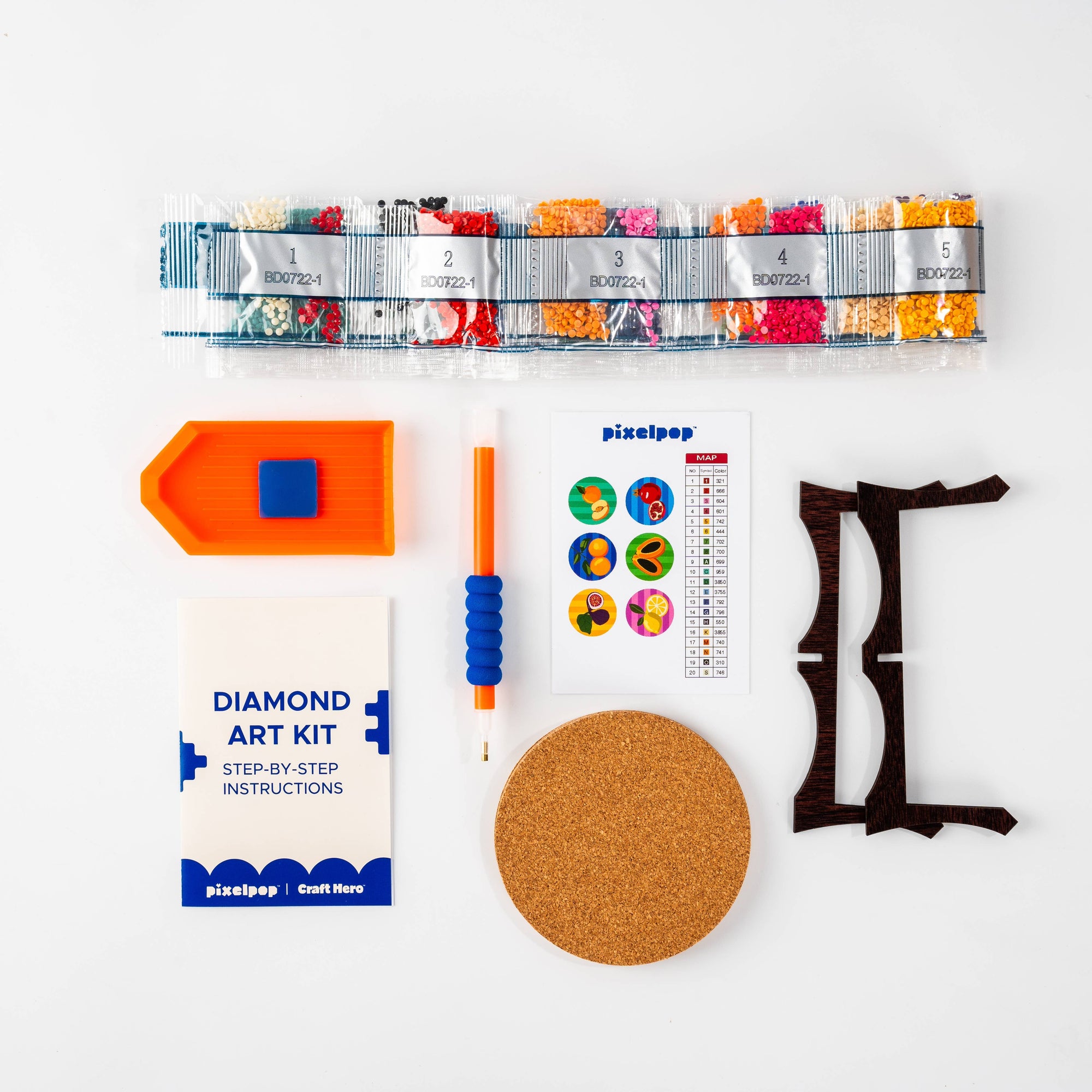 Diamond art kit with tools and materials on a white background