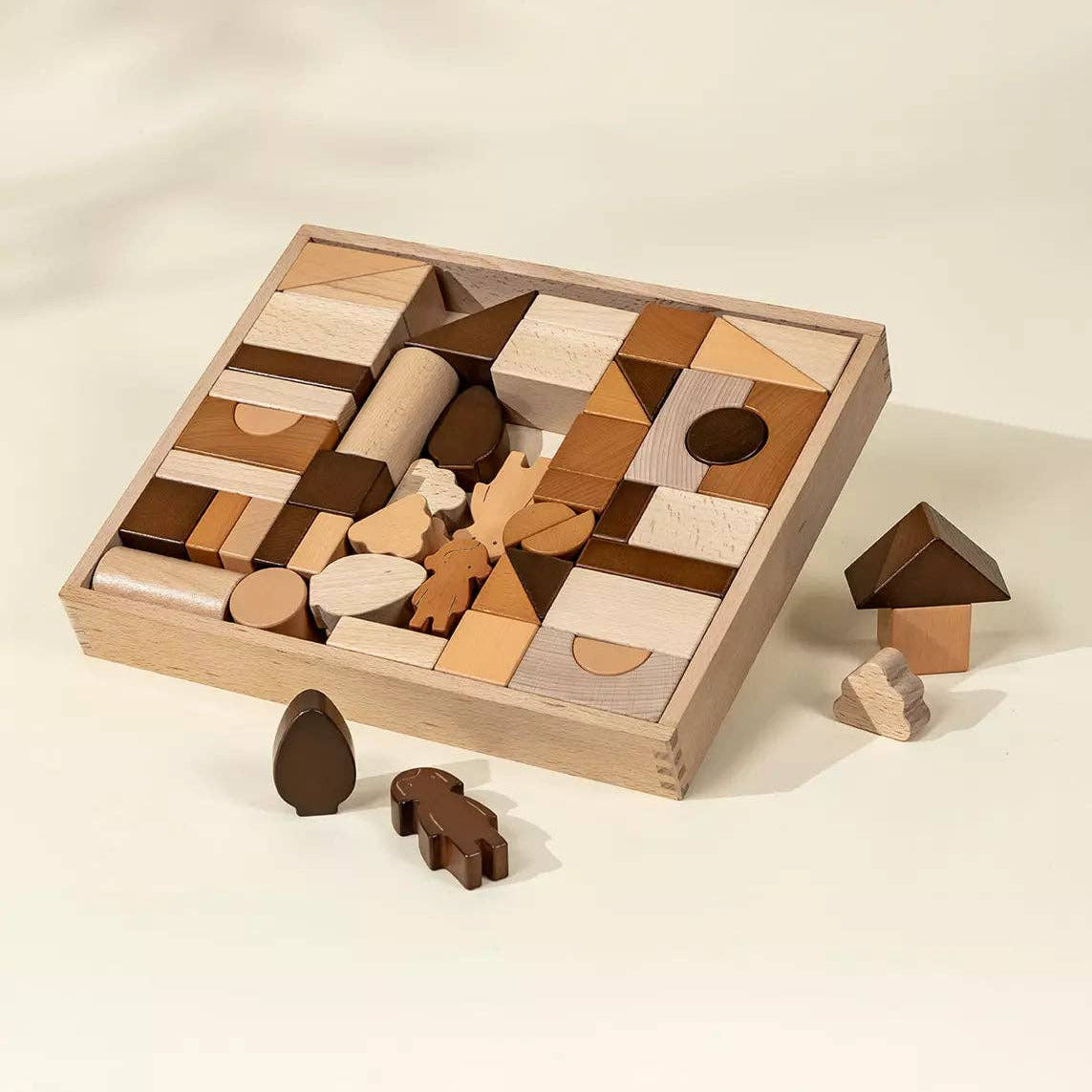 Wooden puzzle with various shapes and pieces on a beige background
