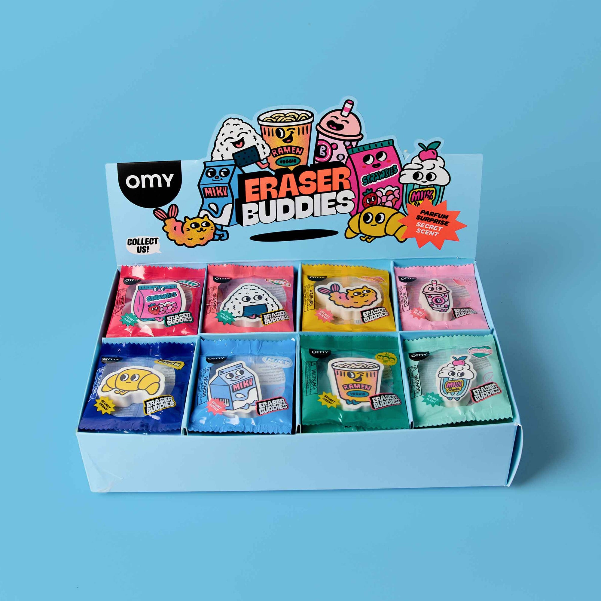 Display box of OMY Eraser Buddies on a blue background