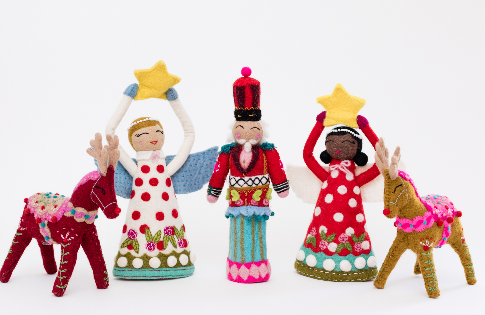 Colorful felt Christmas ornaments on a white background