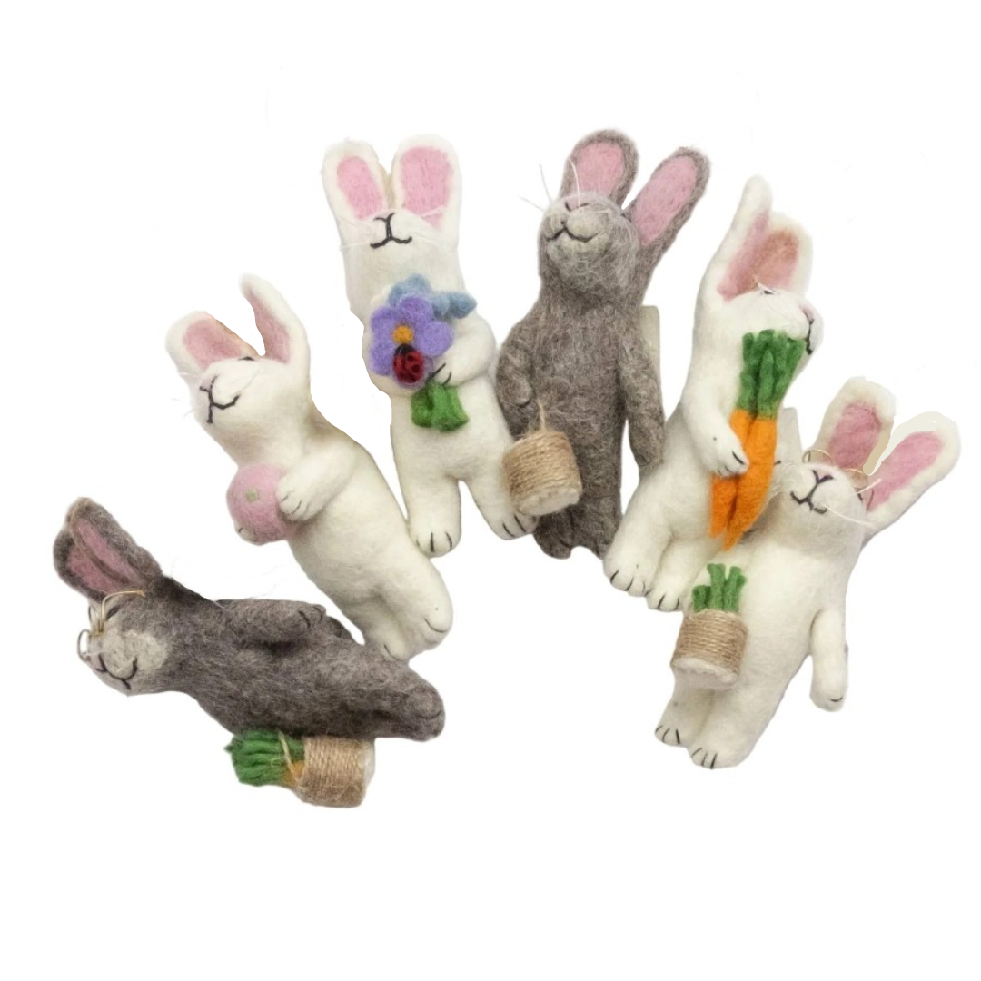 Set of felt rabbit doills on a white background
