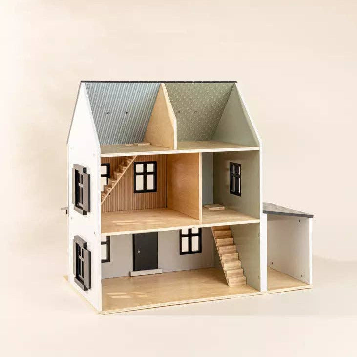 Wooden dollhouse with a white exterior and brown interior on a beige background