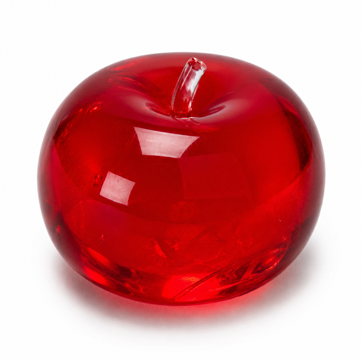 Red glass apple on a white background