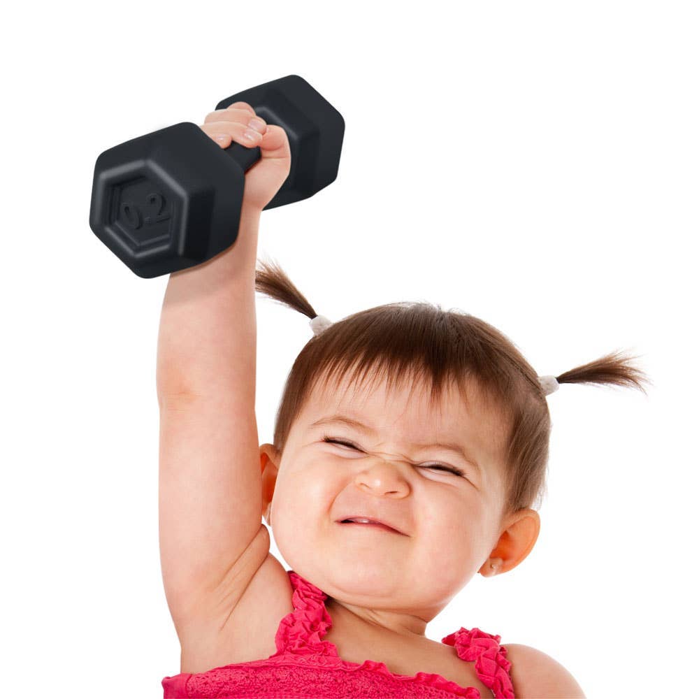 Child lifting a black dumbbell against a white background
